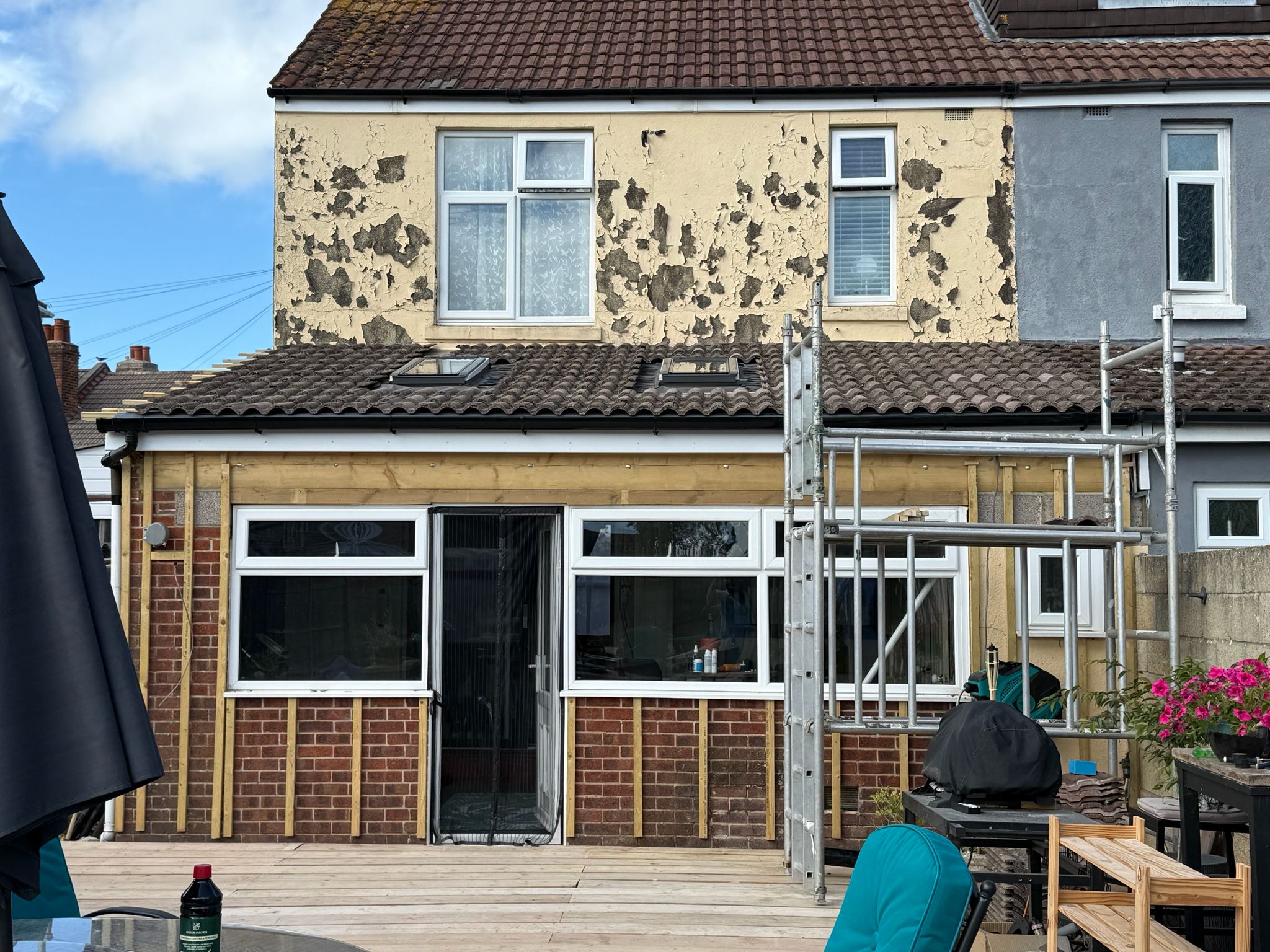 Scaffolding up, new dormer roof going on, cladding being prepped